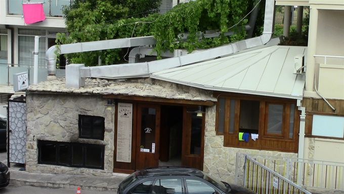 Teraca from our balcony. Charcoal oven is the black door to the left of the entrance.